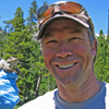 Chauncey Anderson holding a Bufo boreas, Spruce Lake, CO, during Bd-water method development. Photo credit to Don Campbell, USGS