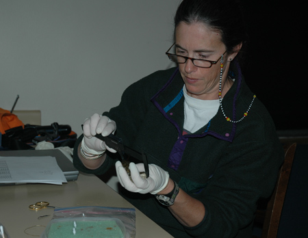 FORT scientist Erin Muths measures a boreal toad<br />Photo by: Blake Hosack